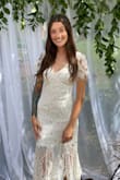 I got this dress for my bridal shower and I absolutely LOVED it. It was so beautiful and such incredible quality. I got soooo many compliments on it the day of my shower, everyone wanted to know where they could get it! I get nervous ordering online but this fits true to size, it has a perfect fabric so it has a little stretch to it which I love. I honestly wish I could wear it everyday. - Sabrina M.