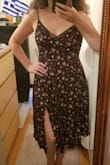 I'm really happy with how this dress fits me, even w/o a bra! Flattering in the right places. The only thing I get confused with compared to other customer review photos is how far up the side slip goes on some. For me, it starts mid-thigh on the left....not that I want it any higher! But I guess it depends on the length of your legs? One other thing I noticed that the colors on the floral print are not 100% true to what you see in the image online. In person, the flowers look more "coral/pink" while online the images seem like "magenta/pink". But not a big deal. I wish there was a better up close image of the print. Regardless, I love this dress and very happy. - Joanne B.