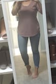 The fit is flattering, maybe a touch longer in the front than I'd like. This can be worn with anything: jeans, shorts, leggings, a skirt. I have this in Mauve, white and olive. I've lived in these all summer long, washed and dried in the dryer with no damage or pilling of material. They do shrink a tad in the dryer but I was ok with that as the length was a bit long. - Amanda H.