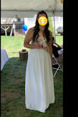 I wore this dress to my bridal shower and loved it! The chest area was slightly baggy along the edges and I had minor alterations done but overall it was a wonderful dress! The fabric felt great and the beading was very pretty. I didn't need a hem because I wore tall wedges - Jihan H.