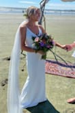 This was the most beautiful, simple wedding dress for my beach elopement. It was thick enough so you couldn't see any panty lines but not heavy. The material is very good quality- similar to crepe material they use for high end wedding dresses. I got so many compliments on this dress! People couldn't believe the price. The only alteration I did was got it hemmed and removed the adjustable straps. I would recommend this dress to any bride-to-be! - Camille M.