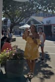 I read through the reviews before I bought it. I'm normally a medium so I bought a medium and a large because I have bigger chest and I'm normally a size 8. The medium was tight so I kept the large even though it was slightly big up top. The yellow is a pretty color, not too bright! Wore it on vacation in Martha's Vineyard! Get it! - Jonelle J.