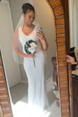 This dress is absolutely beautiful! I got compliments from my family on it all day long. Fit so comfortably and loved the detailed beading and cool geometric shape along the bottom. I wear a 4/6 in dresses so sometimes I need a medium but the small in this dress fit perfectly! I have a different dress for my larger wedding in 2021 that could not have arrived on time but for our quick COVID wedding, this worked perfectly in a pinch. - Camille C.
