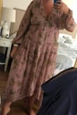 This dress fits a bit big, I sized down and it fit great. It's a bit lower in the bust for me but honestly gives the dress even more of a feminine look. I definitely recommend if you're looking for something that feels like good quality and has an airy and feminine feel to it. - Morgan B.