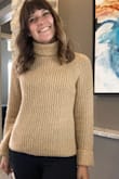 This sweater is SO cute! Great to wear with leggings and black riding boots and even cute enough to wear to work! It's not too chunky, and hits right at the hips, so just be conscious of the belt you wear with it, as it tends to raise when you raise your arms! - Leslie A.