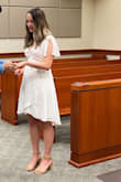 I bought this dress for my elopement. I naively thought it would be easy to adjust how low cut this dress was with safety pins. I completely struggled and had a mini meltdown down the day of my wedding. The dress didn't cover my bra, but was too thin to get away with not wearing one. After the help from my step mom I was finally able to safety pin the dress. If you plan to adjust how low cut it is, and are relatively busty - I recommend going a size up from your normal size. - Maryanne S.