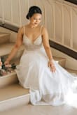 I can't believe how beautiful this dress is in person. There's nothing else I could say other than please don't think twice. Just buy it. You will not regret it for one second. Everyone at my wedding said the sparkle looked like real diamonds in the light and they never guessed it was this cheap! Such a steal! - Faith K.