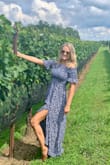 This dress is perfect for my upcoming trip because the fabric is so light and wrinkle-free! I love the slit on the side- the placement was perfect so that it is flirty without being inappropriate. I initially sized up to a S based on the reviews I read, but ended up sending it back for my usual XS which fit perfectly! The dress is very long, so it does pair best with heels of some sort like pictured. - Rachel A.