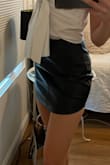 Love this skirt! I'm really into the faux leather trend right now and this skirt is perfect for a night out but can also be paired nicely for a day outfit! It's tight on my hips and thighs but not in a bad way. It scrunches a bit around the middle of the skirt, but that doesn't bother me too much. Just something to be aware of. Overall, super happy with my Purchase! - Ana G.