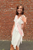 This dress is amazing and I received soooo many compliments wearing it. Dresses usually end up super short on me because I'm long-legged but this was very classy. I did have to use fashion tape for the chest but that was just me being modest. - Haley W.