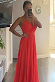 I adored this dress it is a lot better than I expected. I was afraid that the cut might make me look bulky but it does the exact opposite. 

It is a long dress for people who are short and since it has 3 layers it can be a bit expensive to fix that (but that´s on me and my short legs not on the dress) and a tiny bit big up top but not enough to switch down a size.

I cannot wait to wear it! - Fernanda U.