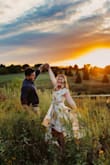 Perfect for my engagement photos! Moved in the wind well. I loved it!! 
I'm 5'4 and 145 pounds. Bought a medium. Zips up really well, but it's a little loose / big in the breast And shoulder area, and I don't have small breasts. I had to have it tailored. - Laura B.