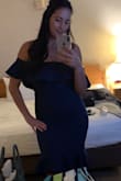 Got a medium and it fit like a glove. I loved that I didn't need to wear a bra with it. Fabric is think enough to keep everything in place. - Ana D.