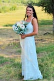 This dress is exactly as described! I wore it for my wedding pictures (canceled ceremony due to covid) and it was perfect! I am taller so it was just barely long enough for me but that is what I expected because of other reviewers. I have slightly larger breasts and didn't wear any support and it was OK, if I was wearing it all night for a ceremony and reception I might have tried to find some support that worked with the dress. I did have to tie it kind of tight for it to stay in place but it didn't slip around and wasn't uncomfortable. Best wedding dress for the price, couldn't have asked for anything better. I ordered a Medium. - Kelsie G.