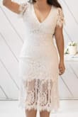 This dress was perfect for my legal wedding ceremony. Our wedding has been postponed, but we decided to get legally married nonetheless. I didn't want to wear my actual wedding dress so I order this one in medium. It did the job for the type of event, and I received many compliments. The solid lining underneath is a bit on the short side, despite the lace being longer. Unfortunately, there is no structure or boning in this dress, and it is quite thin. Was a bit loose in the shoulders. Overall, I was happy with it. - Jessica O.