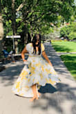 I love this dress a lot, but my main issue with it is the bust area. I ordered it for my brother's wedding. I usually wear medium but I ended up getting another in large. 
The medium was great overall except for the very deep and revealing cleavage. I went to a tailor and she tried everything (we thought to just add another fabric underneath to cover) but she suggested I should order a large. My bust is 34D (or DD depends on brands). I find the picture of the model to be misleading because the model doesn't have large breasts at all. D cup is very common so I didn't expect to have so little material on that area. I ended up getting the large dress which was a tad big on my body overall and even around my upper body but I had enough material to work with to close up the cleavage so it wasn't so revealing. The belt itself folded around itself so many times that it was a bit annoying. It didn't sit right. 
Aside from that, I got lots of compliments on the dress, it is beautiful but I still have to tailor it. - Hila N.