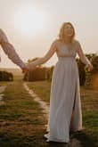This dress was so perfect for our vineyard engagement session! I had to get it hemmed in the shoulders to make it tighter so my chest didn't fall out but other than that it fit perfect!!! - Lacey C.