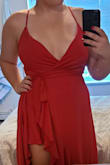 I love this dress! It is super flowy and comfortable when you walk, and photographs well (the color is so vibrant =
). Its a true wrap dress, and the only reason I give it 4 stars instead of 5 is because the bust is too loose (can't wear a strapless without it being seen), and I either have to tie it so tight that it suffocates my rib cage, or use an obscene amount of boob/dress tape. Because I have to tie it so tight to cover my chest, it accentuates my hips which I'm trying to make less noticeable with the wrap-style dress. Otherwise, its gorgeous! - Jordan M.