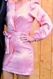 This dress is beautiful. The material is silky and shiny and very comfortable. I loved the color, cut and most of the fit but the sleeves were a little big. Also, I'm super short so the neckline on my short torso left me totally exposed, but one quick stitch over my bust did the trick. Overall, felt great and got lots of compliments! - Lindsey C.