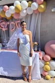 I wore this dress to my bridal shower and it fit perfectly! It's lacy and not super comfortable. I always struggle between picking from a size XS or Small, but a Small worked for me! XS would have been more form fitting. It is a strapless dress I didn't have to keep lifting up in order to keep from falling from chest. Overall, a great dress to dress up or keep casual. - Maribel H.