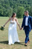 I ordered this 10 months before my wedding and was obsessed!! It's so elegant and light, the bead work was absolutely stunning, and you cannot beat the price! The cups that come with the dress did NOT hold up the ladies, so I had my seamstress sew in cups to give the girls a lift. She also hemmed it slightly but left the rest to flow beautifully the day of my wedding. - Amanda D.