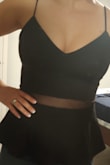 Fits great. Stretchy, little flair at the bottom. Very feminine. Reinforced material in the bust area so you don't need to wear a bra. Will go great with a dark pair of jeans and some fabulous heels. - Stefania M.