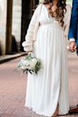 This dress was insanely long and needed to be tailored. I definitely should have sized up because it was too tight on the chest but it was my impromptu wedding dress so did not have time. Overall it was very flowy and great coverage so it wasn't too revealing. The length would probably fit comfortably for someone who is 5'6 or above - Zoe M.