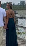 The dress can be tightened on the top with adjusting the straps. I absolutely loved the back on it. It's very long so if you are only doing photos in it you're fine, but if you plan to walk in it all day you'll need a hem. 
Very comfortable. - Christine H.