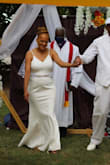 Amazing dress for a backyard wedding, has great little details like the peek of lace at the hem in the back, buttons down the back and lace detail v neck. We did have it altered for my mother in law because it was too long (ordered a large to be safe). Dress is lined and not see through the right foundation garments make a world of difference. Our seamstress also took the extra fabric from the hem and made a belt to complete the look. - Jennifer F.