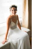Wore this for my backyard wedding this past weekend and it was such a show stopper! It was the right amount of casual and elegant! The dress does run very long and I wore 4 inch wedges and still was having to hold it up BUT I didn't have time for alterations so I made it work! 

I could have also had the straps by the back taken in but I didn't feel like I needed to do it! I fluctuated between a medium and a small. I ended up going with the smaller size and plan on letting another COVID bride in need have it since it was passed on to me in the same manner! - Katelyn S.