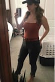 I got the rust orange and it's the perfect orange for fall. Runs a little small, so when I wear an underwire bra, the padding usually peaks out at the top, so I wear a cute bralette with this top. - Beth N.