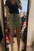 This skirt is so cute. It definitely runs a little tight/short, but not enough to order a size up in my experience. I love the green color and the tassels! The material feels really nice. - Alexia S.