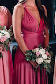 Absolutely loooved this dress! i'm not a fan or pink or any of the related colors but this one surprised me. It photographed beautifully. The color was perfect and it was so comfortable. I'm a little bustier for my frame and I wore support pasties that worked beautifully since you pretty much can't wear a bra with it. I've been in a few weddings and this is the only bridesmaid dress I would order again/keep for future use! Also, traveled well without need to iron/steam! - Madalyn B.