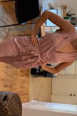 Fit perfectly and works well for me as a Wedding Videographer. Very sheer material (can see my underwear line through even if I am wearing a thong) and bra or bandeau will need to be strategic as the front opens a little more in the front than I realized. I might also just pin the front for work. SO CUTE- BEAUTIFUL COLOR and very flattering. The only other warning is that it is a little tricky to get in and out of- you weasel your way in and out of the top there's no zipper. So for long shoot days, I might not drink too much water because bathroom trips will be tricky. Seriously ADORABLE though. - Danielle D.