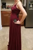I was between a small and a medium because my waist is 30". I ordered both, tried on the small, and it fits perfectly up top! I didn't even take the medium out of the bag. I'm 5'4" and I did have to hem. - Alexis S.