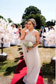 I ordered this dress in two different colors because the bride changed her mind. Both dresses were listed as the same size but one fit and the other did not. So be wary of that. Its a good dress but the fabric will pull around your bust. - Marie-Louise A.