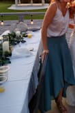 Lots of compliments on this flowy, long skirt. The color is beautiful and was perfect for an outdoor Fall wedding. The back is long, plan on heels!  Definitely high-waisted but perfect for long torsos. Does wrinkle. Paired with a Lulus top to make it perfect! - Andrea G.