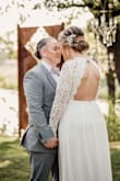 This dress was the perfect dress for my wedding! I did have to get it altered, but totally worth it! I had the arms taken in, the bust taken in, and the length taken up (I wore sparkly Keds). I wanted to feel gorgeous and comfortable at the same time and this dress did just that. - Natalie G.