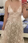 This dress is just beautiful. It fits true to size. It is a little longer, but perfect for engagement, or baby showers pictures. I do think they should add some padding so one should not have to wear a bra. It was a little bit loose in the breast area, but nothing to big. With the bra fitted perfectly, but the straps of the dress were so thin and the v line so deep that a bra was not a choice. In general a beautiful dress. - Dailenys R.