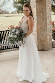 Had to find a last minute wedding dress because COVID changed all of our plans, but I couldn't be happier with how this dress looked. It's stunning, and for the price, you can't beat it. It was long, and didn't have time to get it hemmed but didn't bother me! - Keagan S.