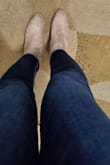 These booties are slighty larger than expected.  I usually buy 8 or 8.5 in boots & booties so i can wear thicker socks in winter. I bought these in a size 8 and they are still a bit roomy. However, i think that works perfectly for me. These booties also go great with dark jeans, or leggings. I think they especially look amazing with dark blue jeans like the ones I'm wearing in the pic. The suede material looks very nice. The heels are pretty comfortable considering they are block heels and not too high. I did some walking around in them for several hours and had no foot  pain. Love these so much! Will be wearing them often. Perfect for fall, but also great in winter (just avoid wearing them on rainy or snowy days due to the suede). - Laura D.