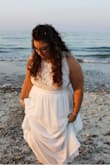 I bought this dress for my wedding and felt SO beautiful in it. We planned everything last minute, so I did expedited shipping and it came very fast! I ordered both a L and XL and wore the XL. It fit perfectly. I didn't need a bra with it, it was snug in all the right places. I'm short, and curvy and was VERY comfortable in this dress, which is hard for me to find! I love love love it. It was so comfortable to wear all night! It was long, and I didn't have time to have it hemmed but I wore heels, and held it up which I walked. I made it work. If I had time to hem it I would have though. Material feels great! Doesn't feel cheap at all. And the return process for the size I did not wear was very easy! - Judee K.