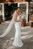 The material is thick and not see through. I did not need to alter the length, it was perfect with heels. It was perfect for the elopement we had in 2020! - Moriah H.