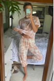 I'm reviewing both the top and bottoms here. The bottoms are great, definitely bigger and longer than other Lulus medium joggers but I wanted them loose to grow into during pregnancy! I'll throw them in the dryer and not worry about it. The material is so comfy and much lighter weight than most sweats so I can wear them for most seasons in Southern California . The biggest downfall is they don't have pockets!!!! The top is a soft t-shirt material (different than the bottoms) so it actually makes the colors look a bit off if you wear them together and look closely but I've already worn the top knotted in the front with high waisted jeans and got a ton of compliments (which is funny because it's just a classic tie dyed T-shirt.) - Salena M.