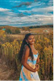 I was so amazed with how this dress complemented my skin tone. It hugs the body beautifully, not too tight, yet not loose fitting. The straps are set so that you can tie them however you please. Great material, I loved how I looked in this, and that was validated by the several compliments I received while wearing it! - Tahana A.