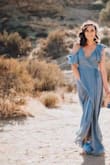 This dress is gorgeous! I always have a hard time finding a dress that's long enough for me because I'm tall and this one touched the ground. Used it for a photoshoot and it was perfect in the wind. - Melanie C.