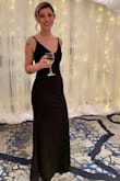 I wore this to a Christmas gala and I received a ton of compliments.  Simple and elegant.  The material is thick and good quality and I found there to be a good stretch if it's needed! - Leah O.