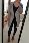 This coat is lightweight and cute! It definitely runs a big so order down a size. - Tiffany U.