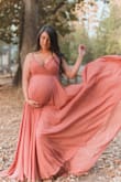 I'm obsessed with this dress! I'm soooo beyond happy I purchased it for my maternity shoot. I love how beautiful it flows. I was 36 weeks pregnant and I love the fit, and it had plenty of room for my baby bump, very comfortable.
Height: 5'3"
weight: 152
Bust: 36in
under bust: 31.5in
baby bump:42in
hips:40 - Darlene C.