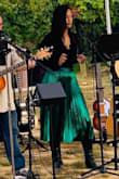Good quality material! Beautifully done. I'm tall with a long torso, so it's a risk buying these types of tops. I was able to perform all night in it. - Cait F.